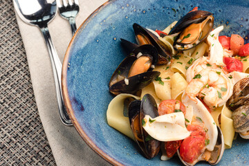 Pasta with seafood, pasta with shrimp mussels squid. pasta with sea delicacies
