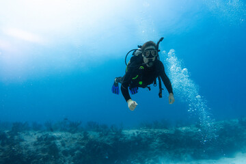diver surprised by the coral reef
