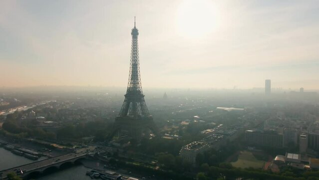 Establishing Aerial shot of Paris Skyline with Eiffel Tower, France. Landmark Monument as Famous Touristic Destination. Romantic Travel and Urban Cityscape Panorama. 4K drone view