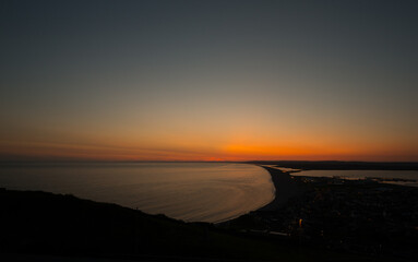 sunset on the beach chesill beach weymout dorset landscape