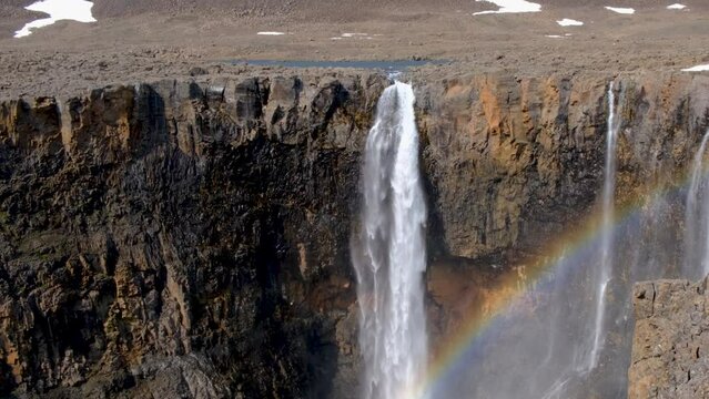 View on a waterfall with rainbow at Putorana plateau