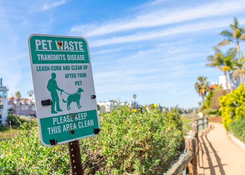 A Pet Waste Sign Is Posted In Marina Del Rey, CA Advising Owners To Clean Up After Their Dog.