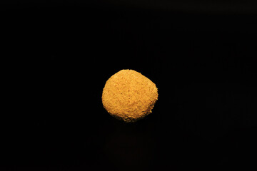 CBD hash rock single black background (Hurcann.com)