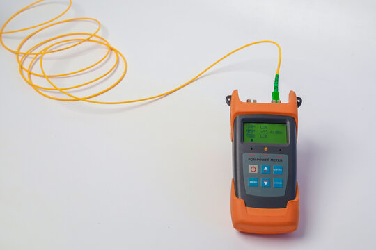 Professional testing of fiber optic connections OTDR meter. Measurement of the throughput of the optical fiber network. Expert work in the IT industry.