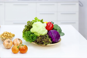 Healthy living and Vegan food. Cooking vegan food. Salad vegetables in a bowl are placed on the table.