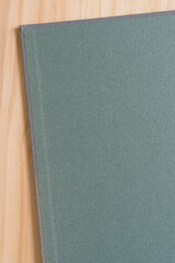 inside endpaper of a book on a wooden surface