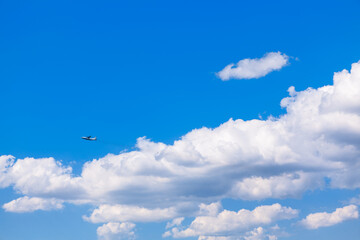 Plane in the clouds . Flight in blue sky 