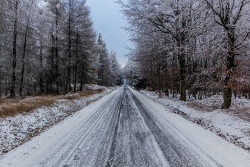 Obraz na płótnie Canvas Winter view of a road near Tisa, Czech Republic
