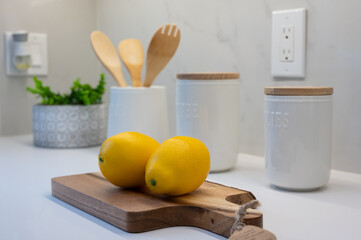 lemons on a wooden  cutting table on the kitchen  counter