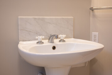 Bathroom sink with marble background 