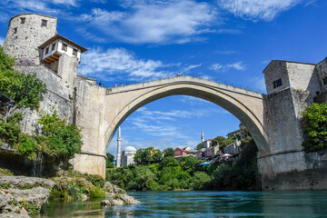 Fototapeta na wymiar The Old Bridge, Stari Most, with the emerald Neretva river in Mostar, Bosnia and Herzegovina.