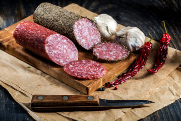 Sliced salami on cutting board