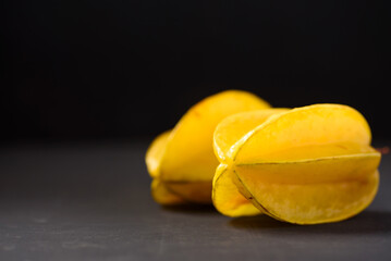 Star fruit on black background. Organic fruit from Thai farmer in local market