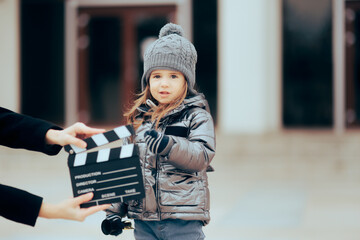 Child Acting Natural Looking at the Camera Filming a Commercial