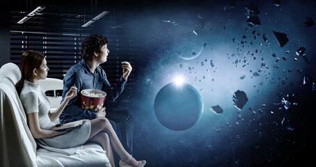 Young couple watching 3D movie