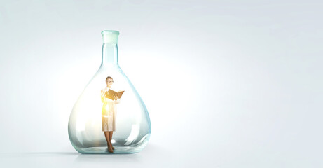 Business woman standing inside a glass bottle . Mixed media