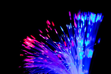 Close up of blurred light fiber optics for communication technology network