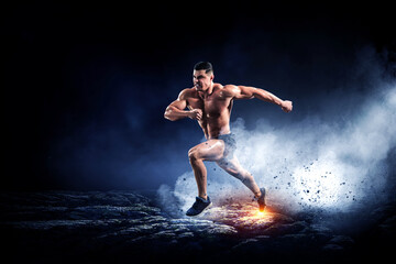 Obraz na płótnie Canvas Male runner against dark background