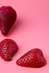 Close-up fresh strawberry on pink background