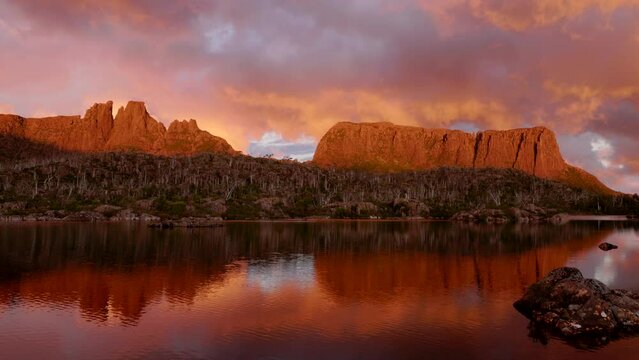 a bright red sunset shot of mt geryon, the acropolis and lake elysia at the labyrinth of cradle mountain-lake st clair national park in tasmania, australia