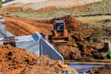 Reconstruction road and small bridge over drainage water canal during the repair