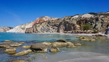 Fototapeta na wymiar Greek Island beach with rocks