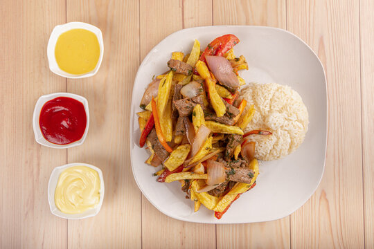 Peruvian food, Lomo saltado, beaf with potate, onions and tomato