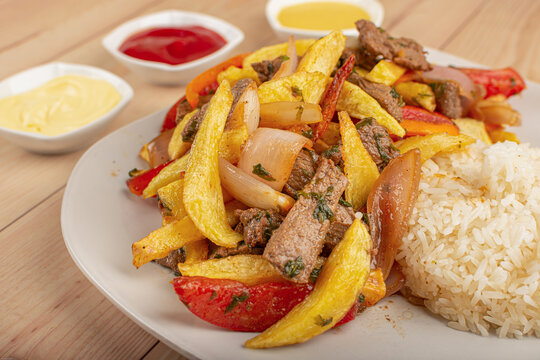 Peruvian food, Lomo saltado, beaf with potate, onions and tomato