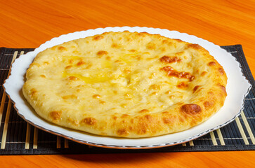 Ossetian pie with vegetable or meat filling. Tasty and healthy national food of eastern peoples.