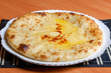 Ossetian pie with vegetable or meat filling. Tasty and healthy national food of eastern peoples.