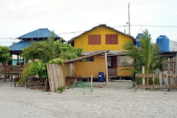 Colorful buildings on the beach in Las Penas, Ecuador