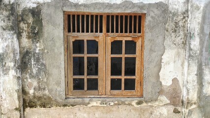 old wooden window of vintage house in urban area