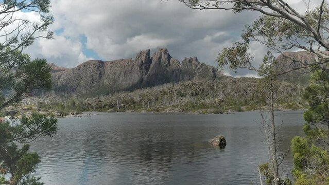 mt geryon and lake elysia framed by trees at the labyrinth in cradle mountain-lake st clair national park of tasmania, australia