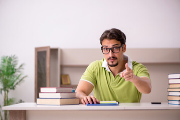 Young male student studying at home