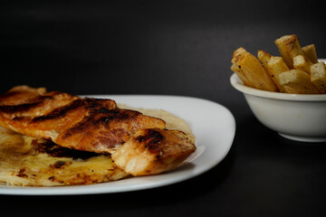 Delicious chicken sandwich on black background