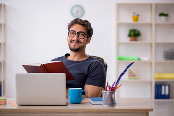 Young male designer working in the office