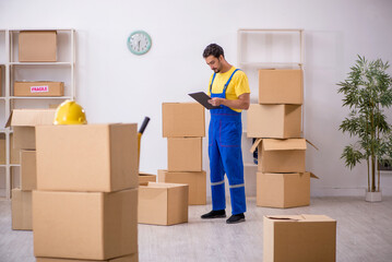 Young male contractor doing home relocation