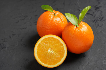Fresh Orange fruit on black stone table background.Orange Fruit