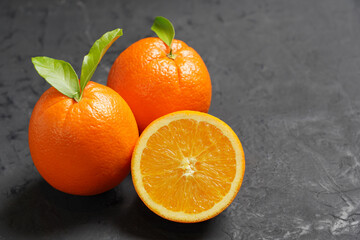Fresh Orange fruit on black stone table background.Orange Fruit