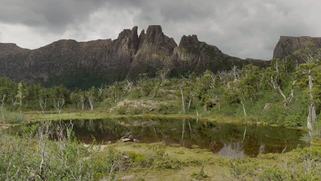wide view of mt geryon and the pool of memories on a summer day at the labyrinth in cradle mountain-lake st clair national park of tasmania, australia