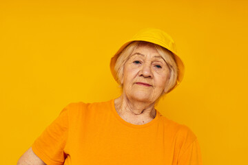 elderly woman happy lifestyle in a yellow headdress close-up emotions