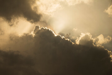 Sun behind the clouds