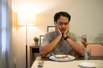 impatient muslim male waiting to break his fast