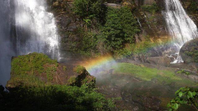 Beautiful rainbow colors in the condensation drops that are released from the huge Wachirathan waterfall in Thailand. Close up shot