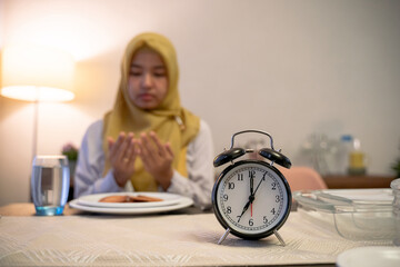 woman praying thanking god for the food during break fasting