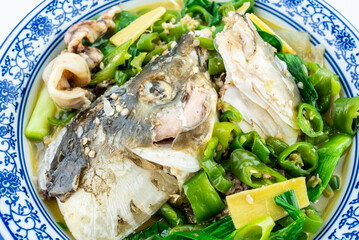 China Hunan home cooking fish head with green pepper and grass