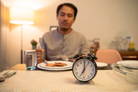 man praying thanking god for the food during break fasting