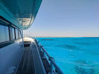 Beautiful view of the azure red sea from the deck of a large white yacht. Hurghada, Egypt.