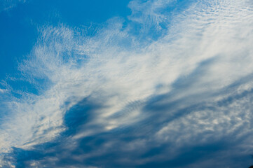Awesome blue sky with fuzzy white clouds. Image for background