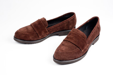 Dark brown suede slippers. Close-up shot.